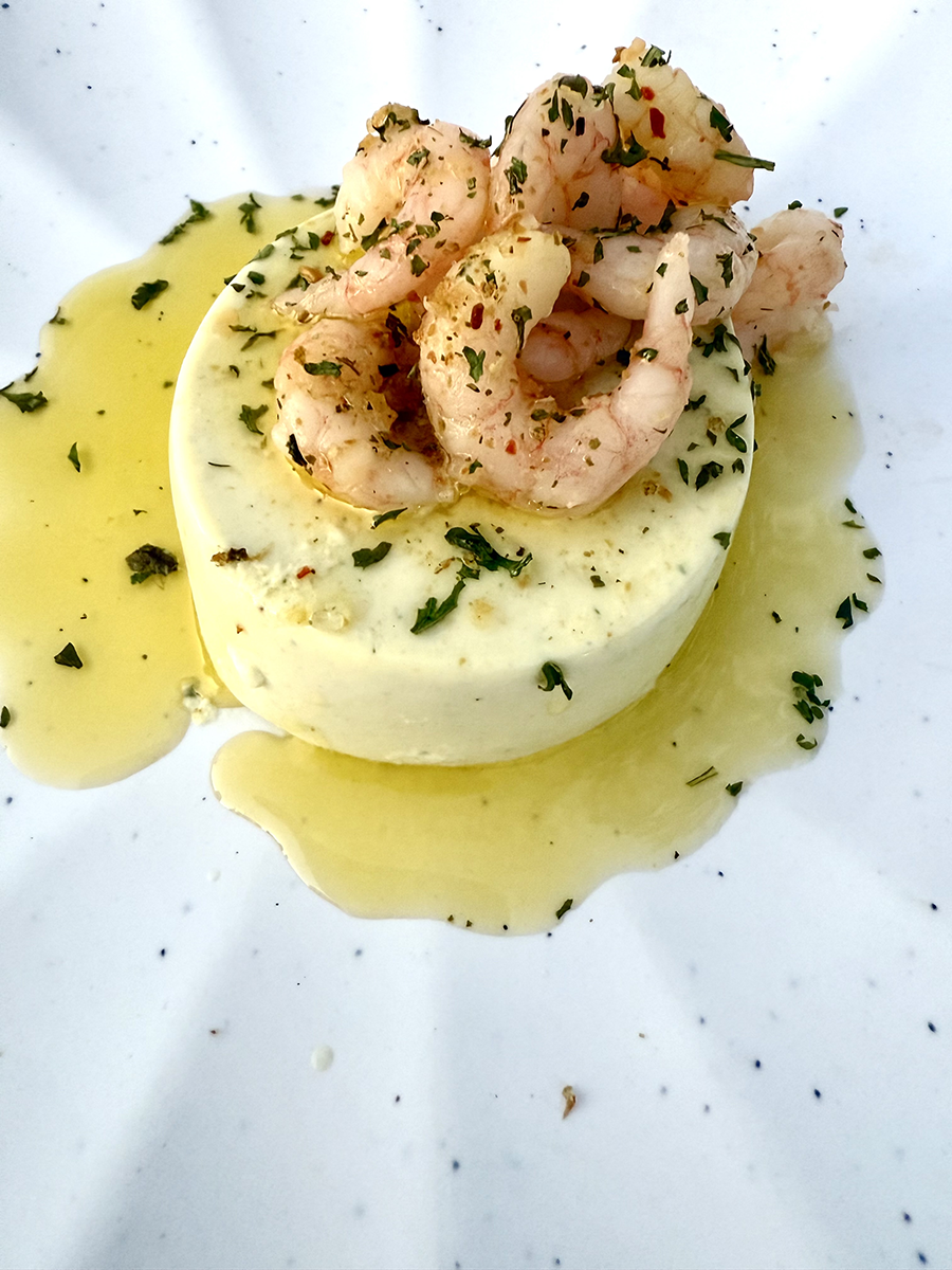 Shrimip cheese and herbs drisled with olive oil